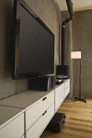 Large flat panel television and entertainment center in a modern loft. Vertical shot.の写真素材