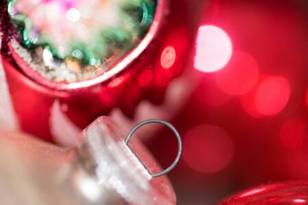 Extreme closeup of two vintage glass Christmas ornaments leaning on each otherの写真素材