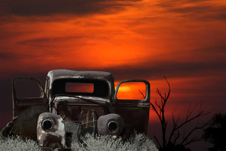 Montage of an old car against a sunsetの写真素材