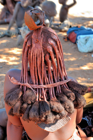 Ochre colored hair of a Himba woman indicating her mature statusの写真素材