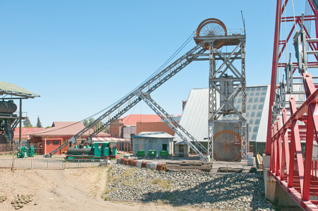 Headframe (also known as a gallows frame, winding tower, hoist frame, pit frame, shafthead frame, headgear, headstock or poppethead) at the historical Big Hole, diamond mine, Kimberley, South Africaのeditorial素材
