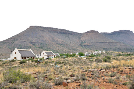 BEAUFORT WEST, SOUTH AFRICA - DECEMBER 2014: Unidentified people on the fossil trail in the Karoo National Park. Chalets in the rest camp is visible.のeditorial素材