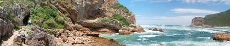 KNYSNA, SOUTH AFRICA - JANUARY 5, 2015: Panorama of anglers at The Heads in Knysna where the lagoon enters the seaのeditorial素材