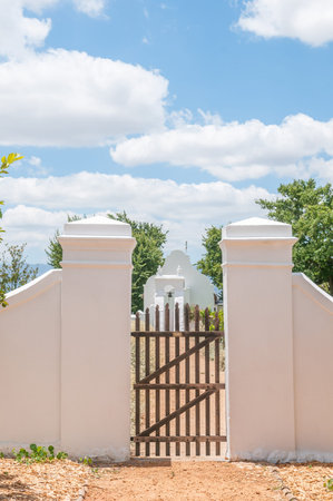 PAARL SOUTH AFRICA  DECEMBER 21 2014: Gate with an historic slave bell in the back on the...