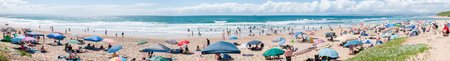 MOSSELBAY SOUTH AFRICA  DECEMBER 29 2014: Panorama of unidentified people at a beach in Klein Brakrivier near Mosselbay South Africaのeditorial素材
