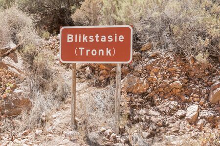 SWARTBERG PASS SOUTH AFRICA  JANUARY 2 2015: Sign at the ruins of the Blikstasie old jail in the historic Swartberg Black Mountain Pass. The pass is a declared national monument.のeditorial素材