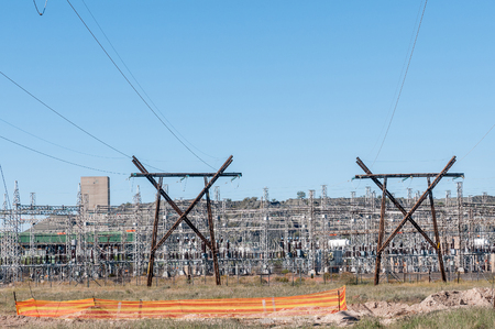 KIMBERLEY, SOUTH AFRICA - APRIL 5, 2015: Electricity infrastructure against the backdrop of a mine dumpのeditorial素材