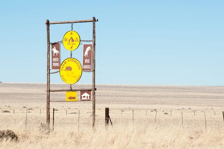 KOIIMASIS, NAMIBIA - JUNE 24, 2012: Sign post in the barren semi-desert area bordering the D707 road between Sesriem and Ausのeditorial素材
