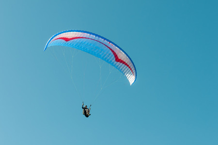 PORT ELIZABETH, SOUTH AFRICA - FEBRUARY 27, 2016:  A paraglider in the air at Beachview near Port Elizabethのeditorial素材