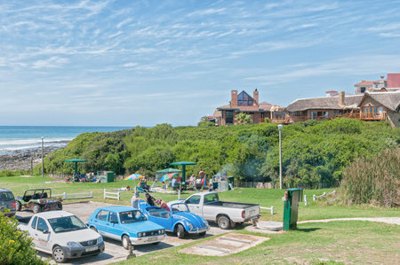 JEFFREYS BAY, SOUTH AFRICA - FEBRUARY 28, 2016:  Unidentified tourists relaxing at Lower Point in...