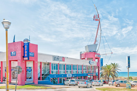 JEFFREYS BAY, SOUTH AFRICA - FEBRUARY 28, 2016:  A street scene with restaurants and an art shop in Jeffreys Bay in the Eastern Cape Province of South Africaのeditorial素材