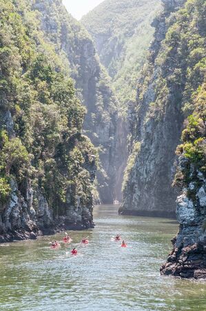 STORMS RIVER MOUTH, SOUTH AFRICA - FEBRUARY 29, 2016:  Unidentified kayakers in the Storms River gorge near the mouthのeditorial素材