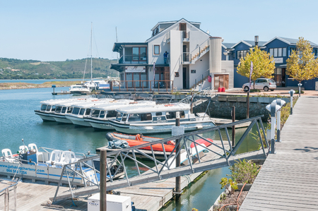KNYSNA, SOUTH AFRICA - MARCH 3, 2016: The Harbor Town on the historic Thesens Island. Several types of boats, including houseboats, are visibleのeditorial素材