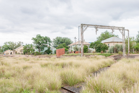 WOLWEFONTEIN, SOUTH AFRICA - MARCH 7, 2016: The station, railroad and houses in Wolwefontein, a small village between Kirkwood and Jansenville in the Eastern Cape Provinceのeditorial素材