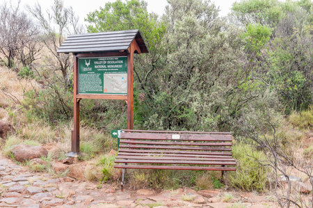 GRAAFF REINET, SOUTH AFRICA - MARCH 7, 2016: An information board and bench at the start of the Crag Lizard trail near the Valley of Desolation viewpointのeditorial素材