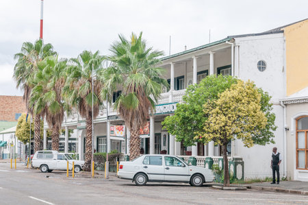 MIDDELBURG, SOUTH AFRICA - MARCH 8, 2016: A street scene in Middelburg in the Eastern Cape Karoo Region. A hotel, restaurant and guard are visibleのeditorial素材