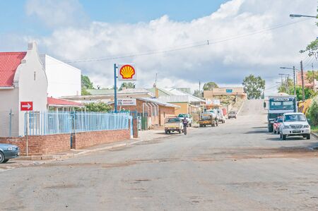 NOUPOORT, SOUTH AFRICA - MARCH 8, 2016: A street scene in Noupoort in the Northern Cape Karoo Region. Businesses, people and cars are visibleのeditorial素材