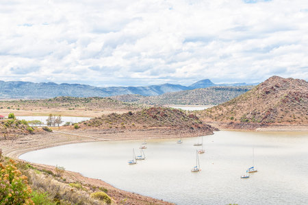 Sail yachts in the Gariep Dam on the border between the Free State and Northern Cape provinces. It is the largest dam in South Africa. The dam is half fullの写真素材