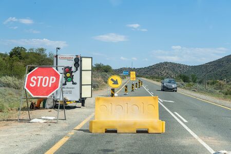 WILLOWMORE, SOUTH AFRICA - MARCH 23, 2017: A traffic control point at roadworks on the N9 road near Willowmore in the Eastern Cape Provinceのeditorial素材