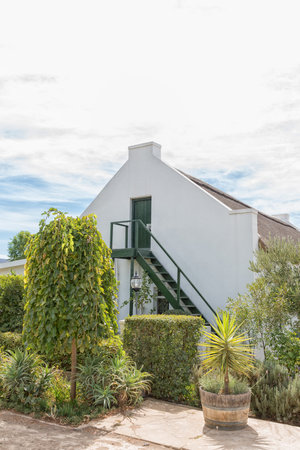 MCGREGOR, SOUTH AFRICA - MARCH 26, 2017: Stairs to the loft of an historic house with thatched roof in McGregor, a small town in the Western Cape Provinceのeditorial素材