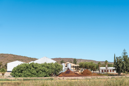 BONNIEVALE, SOUTH AFRICA - MARCH 26, 2017:  Waste from a winery include biodegradable solids, namely stems, skins, and seeds, are used to make compostのeditorial素材