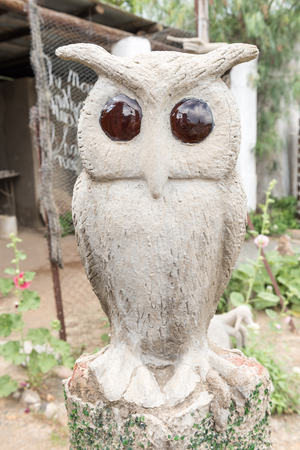 A concrete and glass owl sculpture at the Owl House in Nieu-Bethesda, an historic village in the Eastern Cape Provinceの写真素材