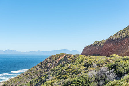 Visitors at a viewpoint on Clarence Drive between Gordons Bay and Rooi-Els. Table Mountain and...