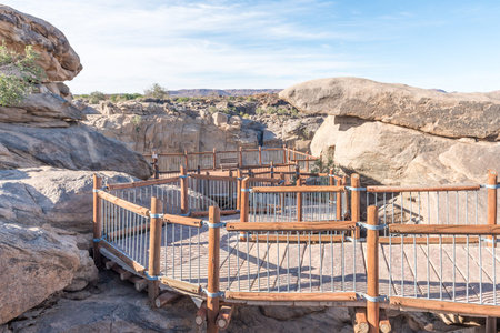 A wheelchair-friendly trail leads to a viewpoint at the main waterfall of the Augrabies Fallsの写真素材