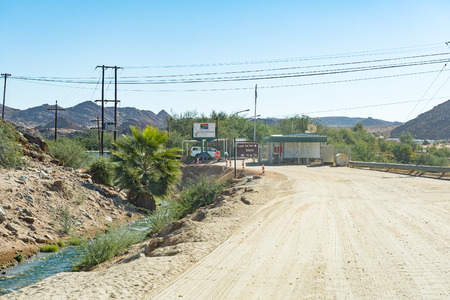 ONSEEPKANS, SOUTH AFRICA - JUNE 13, 2017: The Onseepkans border control on the banks of the Orange River. Namibia is in the backのeditorial素材