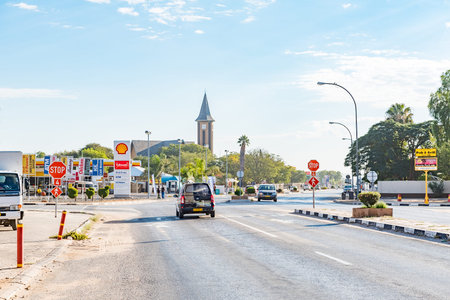 OTJIWARONGO, NAMIBIA - JUNE 20, 2017: A street scene with businesses and the Dutch Reformed Church in Otjiwarongo in the Otjozondjupa Region of Namibiaのeditorial素材