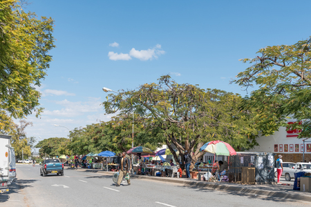 GROOTFONTEIN, NAMIBIA - JUNE 20, 2017: A street scene with street vendors in Grootfontein in the Otjozondjupa Region of Namibiaのeditorial素材