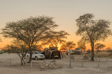 ETOSHA NATIONAL PARK, NAMIBIA - JUNE 23, 2017: Sunrise at the camping sites in the Okaukeujo Rest Camp in the Etosha National Parkのeditorial素材