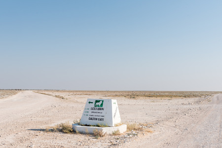 ETOSHA NATIONAL PARK, NAMIBIA - JUNE 26, 2017: A distance sign on the road between the Okaukeujo and Olifantsrus Rest Camps in the Etosha National Parkのeditorial素材