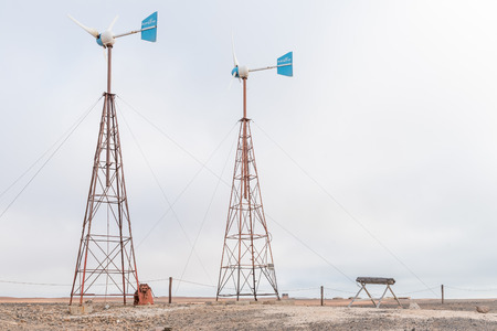 CAPE CROSS, NAMIBIA - JUNE 28, 2017: Two wind turbines at Cape Cross Lodge in the Dorob National Park of Namibiaのeditorial素材