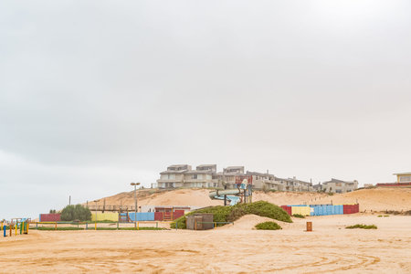 HENTIES BAY, NAMIBIA - JUNE 29, 2017: Houses on a dune and a waterpark in Henties Bay, a holiday town on the Skeleton Coast of Namibiaのeditorial素材