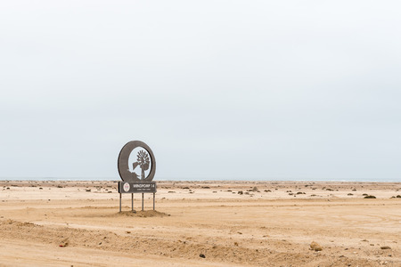 SWAKOPMUND, NAMIBIA - JUNE 29, 2017: Name board of Windpomp 14 (windmill 14), a camping site and restaurant in the Namib Desert to the North of Swakopmund on the Skeleton Coast of Namibiaのeditorial素材