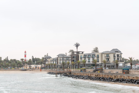 SWAKOPMUND, NAMIBIA - JUNE 30, 2017: The Strand Hotel, museum and lighthouse at the Molen in Swakopmund in the Namib Desert on the Atlantic Coast of Namibiaのeditorial素材