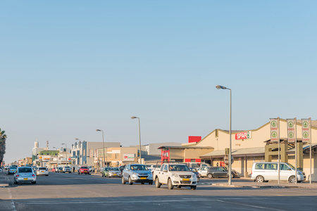 WALVIS BAY, NAMIBIA - JULY 1, 2017: A late afternoon street scene with businesses and vehicles in Walvis Bay on the Atlantic Coast of Namibiaのeditorial素材