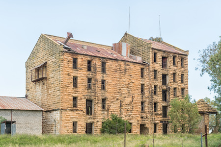 FICKSBURG, SOUTH AFRICA - MARCH 12, 2018: The ruin of the tallest sandstone building in the country, a mill at Gumtree railway station near Ficksburg in the Eastern Free State Provinceのeditorial素材