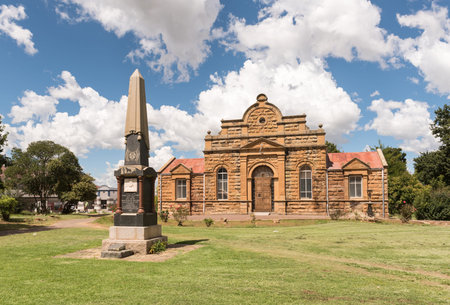 FICKSBURG, SOUTH AFRICA - MARCH 12, 2018: The sandstone town hall, completed in 1887, and the monument for General J.I.J. Fick, after whom in Ficksburg was namedのeditorial素材