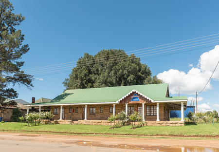FOURIESBURG, SOUTH AFRICA - MARCH 12, 2018: A street scene with a sandstone building in Fouriesburg in the Free State Province of South Africaのeditorial素材