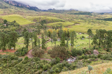 ROYAL NATAL NATIONAL PARK, SOUTH AFRICA - MARCH 17, 2018: Areal view of the Mahai Camp Site in the Kwazulu-Natal Drakensberg. The Mahai river, tents and vehicles are visibleのeditorial素材