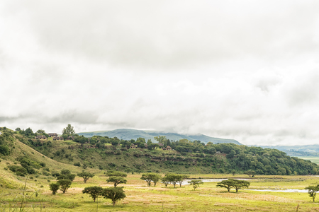 MALOTI DRAKENSBERG PARK, SOUTH AFRICA - MARCH 18, 2018: The Tugela River with the Hlalanathi Resort in the Maloti Drakensberg Park in the backのeditorial素材