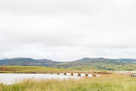 DUKUZA, SOUTH AFRICA - MARCH 18, 2018: A truck crossing the bridge over the Woodstock Dam at Dukuzaのeditorial素材