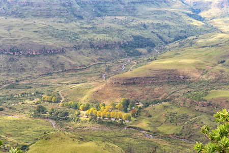 INJISUTHI, SOUTH AFRICA - MARCH 20, 2018: The rest camp at Injisuthi in the Maloti Drakensberg Park as seen from the viewpoint on the Van Heiningen Pass trail. Chalets are visibleのeditorial素材