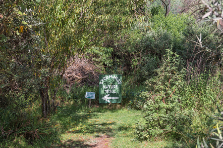HIMEVILLE, SOUTH AFRICA - MARCH 23, 2018: Sign at the start of the Stromness Nature Trail at the Sani Backpackers Lodge near Himeville, in the Kwazulu-Natal Provinceのeditorial素材