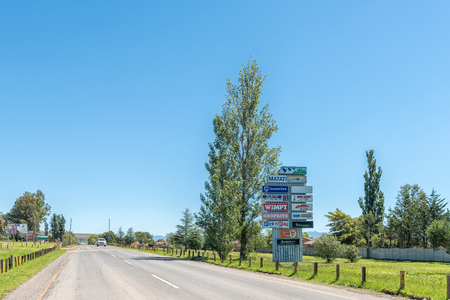 MATATIELE, SOUTH AFRICA - MARCH 26, 2018: A street scene with billboards and a vehicle in Matatiele in the Eastern Cape Provinceのeditorial素材