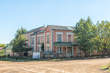 BARKLY-EAST, SOUTH AFRICA - MARCH 28, 2018: A street scene, with the historic Old Mill Restaurant and Hotel, in Barkly-East in the Eastern Cape Provinceのeditorial素材