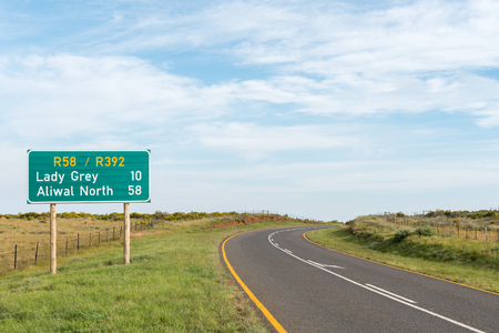 The landscape, with distance sign, on the road between Lady Grey and Barkly East in the Eastern Cape Provinceの写真素材
