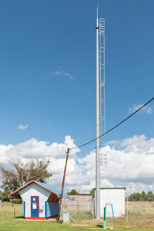 VANSTADENSRUS, SOUTH AFRICA - APRIL 1, 2018: Mail boxes, the telephone exchange and telecommunications mast in Vanstadensrus in the Free State Provinceのeditorial素材